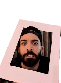 a man with a beard holding up a photo frame