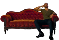 a man sitting on a red couch