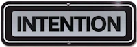 a sign with the word intention on it